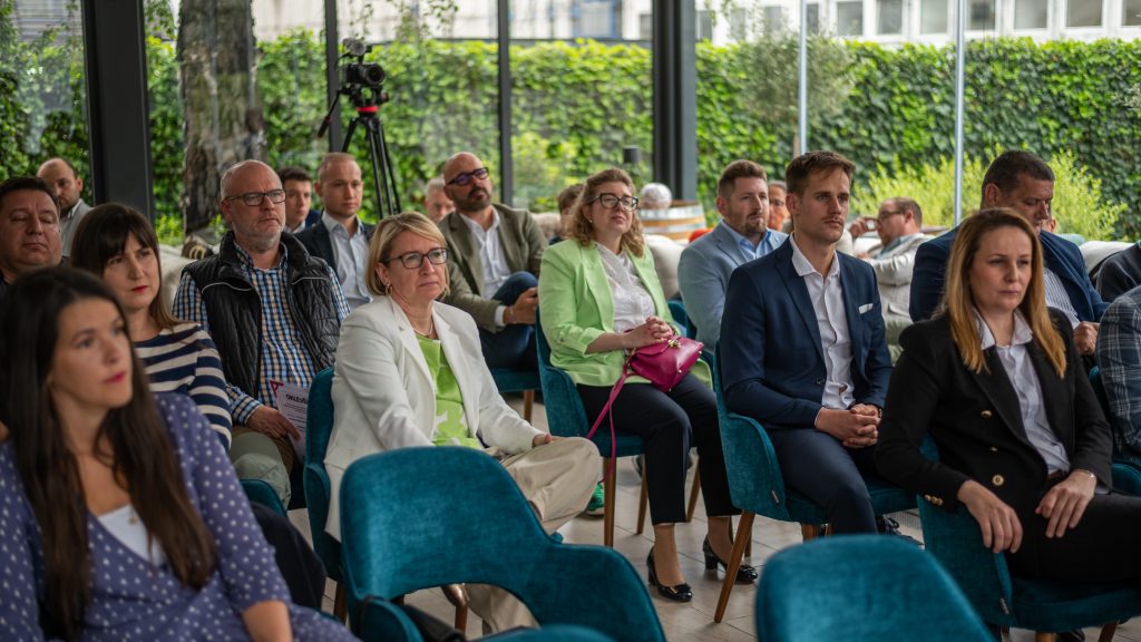 Káldi Wine winemaker standing among the winners before the award ceremony at VinAgora 2025.